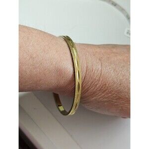 Monet gold tone diamond cut bangle bracelet 7.75"